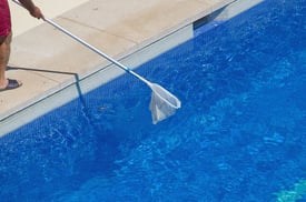 bigstock-Swimming-Pool-Cleaner-147644039.jpg