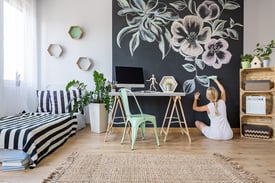 Woman Drawing on In-Home Chalkboard