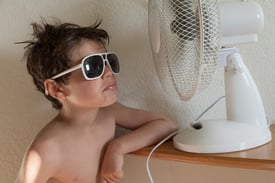 bigstock-boy-cools-with-a-fan-portrait-98450807.jpg