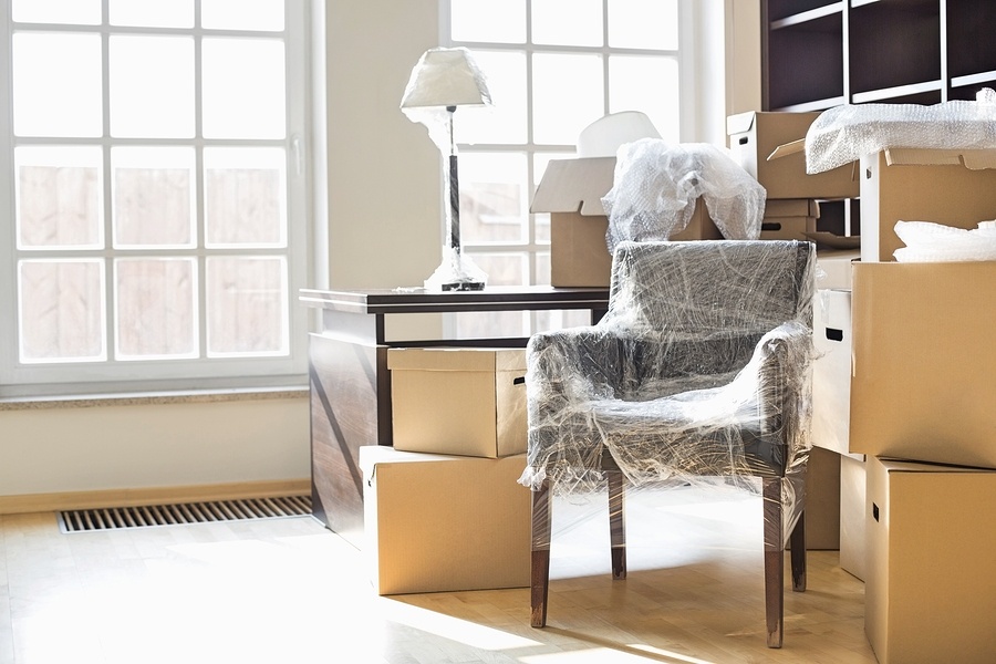 bigstock-Moving-boxes-and-furniture-in--169360670.jpg